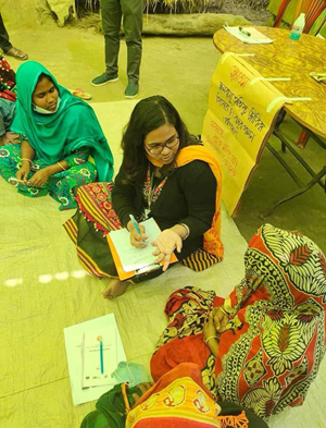 Ummay speaks to women in rural Bangladesh
