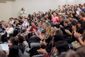 A lecture hall full of people at the 2023 Truscott lecture applauds.