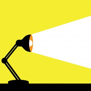 A cartoon graphic of a desk lamp.
