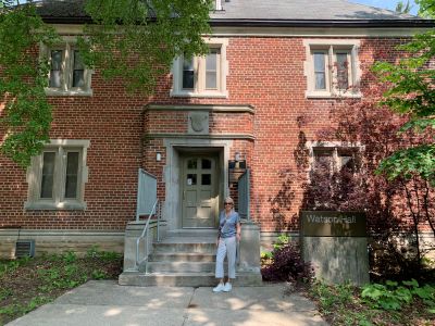 beverley standing in front of Watson Hall smiling
