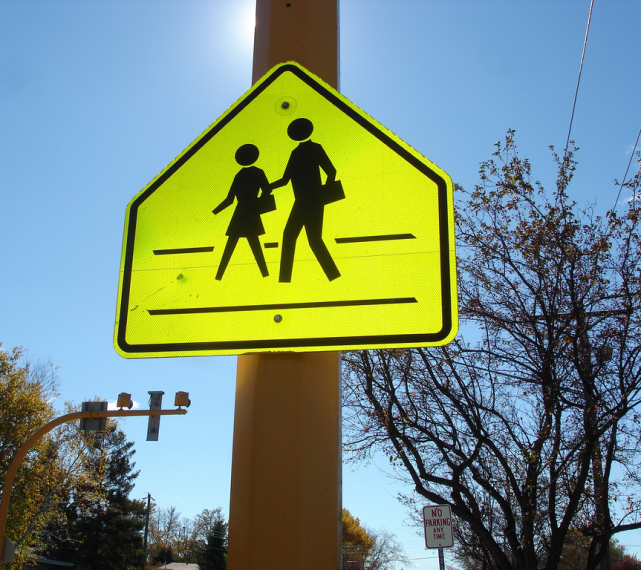 School crossing street sign in yellow