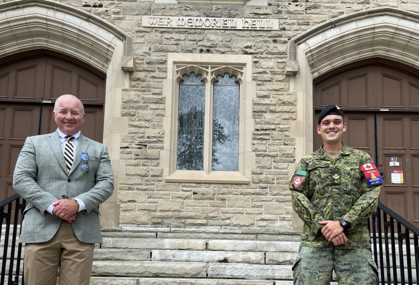 Dr. John Walsh and master bombardier Darren Sargent in front of War Memorial Hall