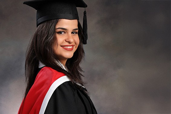 Julia smiling in her graduation photo.